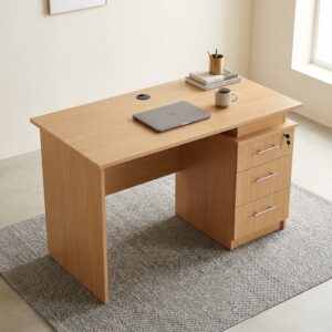 1.2M Office / Home Table featuring a rectangular wood-grain finish top, integrated circular black cable grommet, an attached three-drawer pedestal on the right side, slim metallic-toned horizontal handles, and a top drawer key lock.