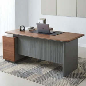 Premium L-shaped Modern Executive Office Table featuring a natural walnut grain desktop with rounded edges, a grey fluted vertical modesty panel, and a matching integrated side-return credenza cabinet.