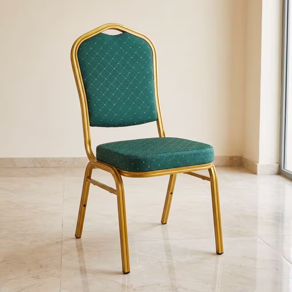 Green Banqueting Chair With Gold Frame placed in a modern event hall setup with elegant seating arrangement