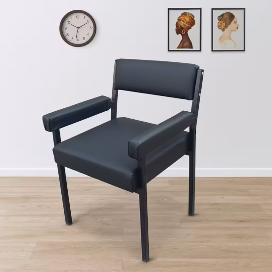 Modern Catalina Office Chair With Armrest featuring black leatherette padding, a black metal frame, and padded arms, set on a light wood floor.