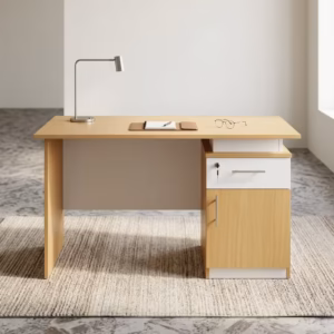 1.2M Office/Home Study Desk in a light natural woodgrain laminate with an integrated side cabinet, a lockable white drawer, a laptop, and books on a textured rug.