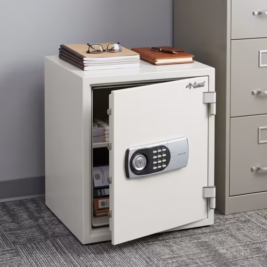 Diplomat Fireproof Safe With Electronic Lock in a light grey textured steel finish, showing its lit digital keypad and manual handle on a secure shelf.