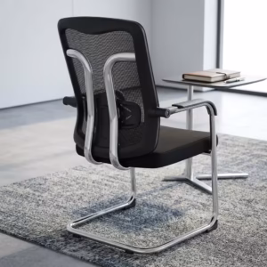 Modern black Ergonomic Mesh Guest Office Seat by TBL Furniture, featuring a breathable mesh backrest, integrated armrests, and a black steel sled base, isolated against a studio backdrop.