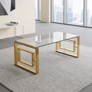 Modern Romimex Glass Coffee Table With Goldish Frame featuring a rectangular multi-coloured glass top and a geometric gold-toned metal base on a plush cream area rug.