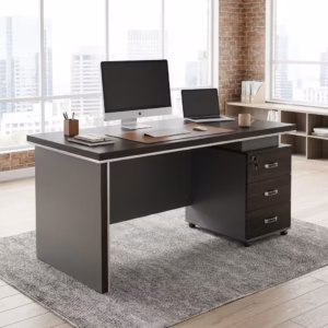 Modern 1400MM Executive Office Desk with charcoal panels, a matching rolling 3-drawer cabinet, and a desktop computer, positioned in a bright loft office.