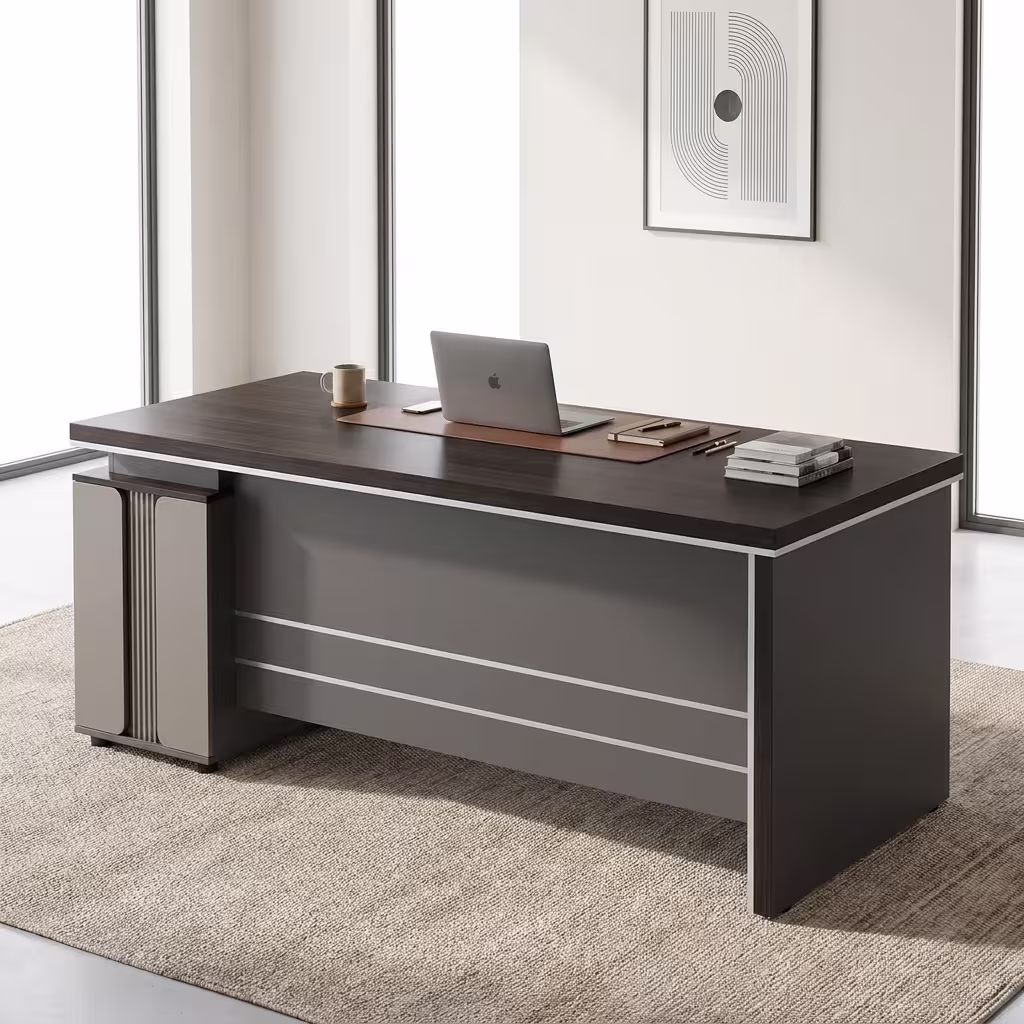 Modern 1400MM Executive Office Desk with charcoal panels, a matching rolling 3-drawer cabinet, and a desktop computer, positioned in a bright loft office.