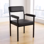 Modern Catalina Office Chair With Armrest featuring black leatherette padding, a black metal frame, and padded arms, set on a light wood floor.