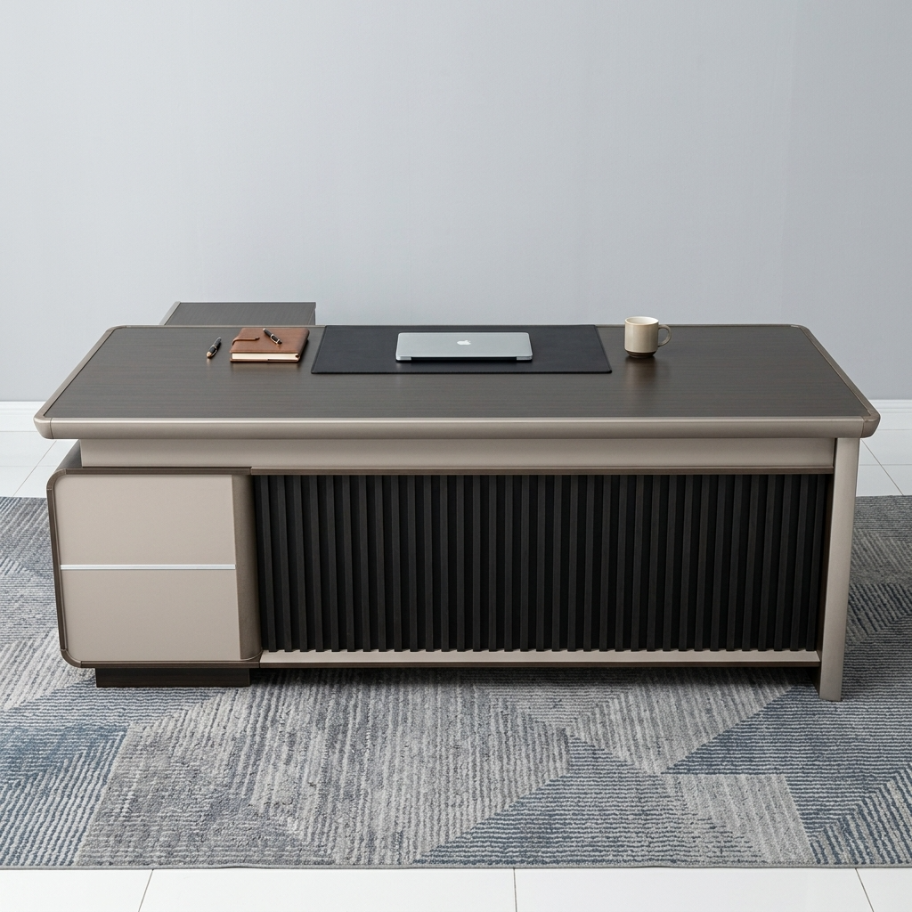 Premium CEO Modern Executive Office Table in a dark charcoal-brown woodgrain finish, featuring a vertical black fluted slatted front modesty panel, an integrated cream-colored side storage drawer pedestal, and a built-in black leather desk blotter mat supporting a silver laptop, resting on a textured geometric area rug.