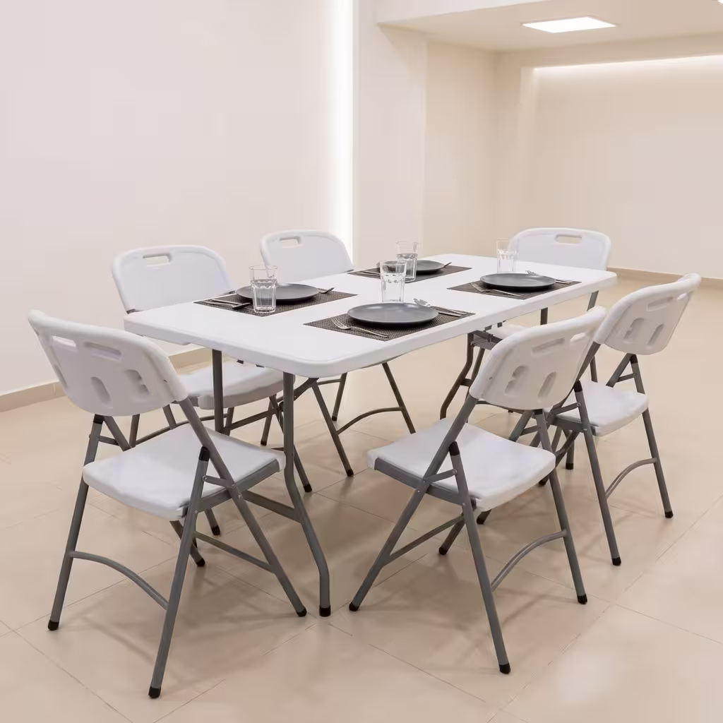 Premium Foldable Table & Chair Dining Set featuring a rectangular white plastic folding tabletop, supported by a heavy-duty powder-coated gray steel frame, surrounded by six matching white plastic folding chairs with integrated carrying handles on a light wood floor.