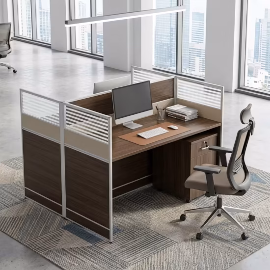 Premium 2-Way Modular Office Workstation in a deep espresso woodgrain finish, showing a private individual cubicle equipped with a silver laptop, writing utensils, a ceramic mug, and a matching lockable under-desk mobile filing cabinet, resting on a textured geometric area rug inside a modern open-plan office.