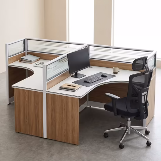 Premium 2-Way Curved Office Workstation showcasing an elevated perspective of a back-to-back dual user layout, featuring curved L-shaped white tables with natural woodgrain side panels, integrated translucent slatted glass privacy partition screens, and active workspaces with a curved monitor, laptop, and a black mesh ergonomic task chair on a smooth grey concrete floor.