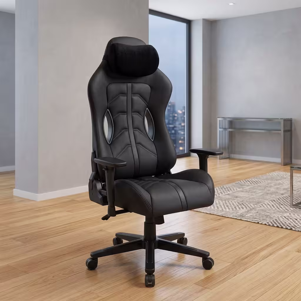 Premium High-Back Ergonomic Black Modern Gaming Chair in a sleek matte black faux leather upholstery, featuring a contoured bucket backrest, an adjustable neck headrest pillow, a matching lower lumbar cushion, rigid armrests, and a heavy-duty black five-star star base with rolling wheels, standing on a polished floor.