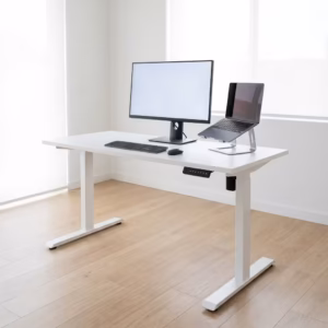 Premium 1.4M Height Adjustable Electric Desk in a minimalist white finish, showing a dual-monitor setup raised to a standing height position in a bright home studio.