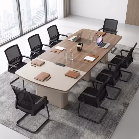 Premium 6-8 Seater Modern Executive Boardroom Table featuring a dual-tone walnut and cream tabletop with integrated cable routing ports, surrounded by black leather cantilever chairs inside a bright contemporary office suite.