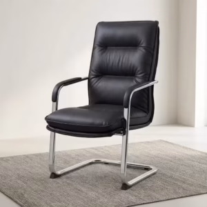 Premium High-Back Cantilever Leather Visitor Office Chair in matte black leatherette with segmented tufted padding, padded chrome loop armrests, and a reflective polished chrome continuous sled frame, standing on a textured geometric area rug.