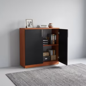 Premium 2-Door Wooden Storage Office Cabinet in a rich walnut woodgrain finish, showcasing two closed vertical swing doors with a centered silver key lock cylinder, standing on a polished concrete floor in a modern corporate office layout.