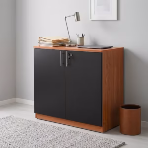 Premium 2-Door Wooden Storage Office Cabinet in a rich walnut woodgrain finish, showcasing two closed vertical swing doors with a centered silver key lock cylinder, standing on a polished concrete floor in a modern corporate office layout.