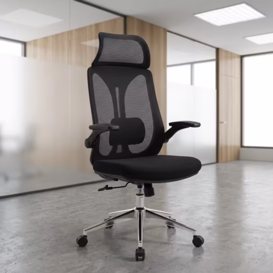 Premium High-Back Modern Ergonomic Office Swivel Chair featuring a black open-mesh backrest, integrated wide neck headrest, flip-up T-shaped armrests, a thick black fabric seat cushion, and a reflective polished chrome star base with rolling wheels, standing on a polished concrete floor.