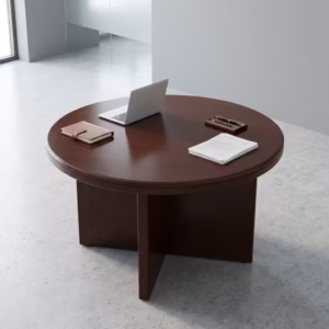 Premium 4-Seater Round Wooden Conference Table featuring a smooth circular tabletop with a rich mahogany woodgrain finish, supported by a heavy-duty intersecting cross-panel pedestal base, surrounded by four black mesh cantilever chairs in a corporate studio setup.