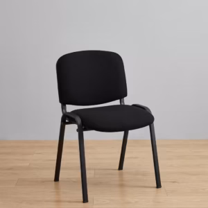 Premium Tosca Stackable Visitor Chair featuring rounded black fabric cushions, an armless low-back profile, and a sturdy four-legged matte black steel frame, standing on a light wood floor against a grey wall.