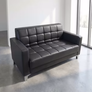 Premium 2-Seater Modern Office Reception Sofa upholstered in grid-tufted black leather with polished chrome legs, standing on a smooth concrete floor in a modern lobby.