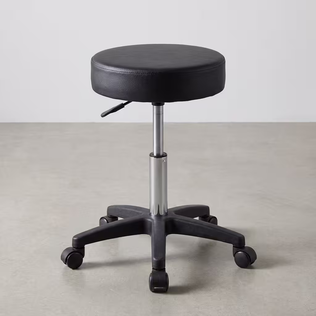 Premium black Height Adjustable Padded Stool featuring a thick circular cushion, a chrome pneumatic lever, and a durable black five-star rolling caster base.