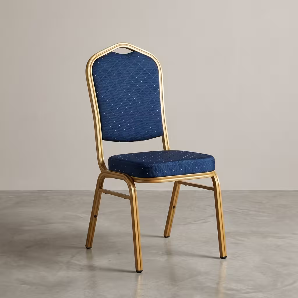 Premium Blue Banquet Chair With Gold Steel Frame featuring a crown-back design in royal blue fabric with gold dots and a highly reflective glossy gold steel frame, standing on a polished event floor.