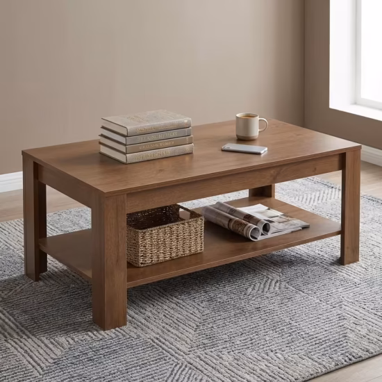 Premium 1.2M Rectangle Wooden Coffee Table featuring a rich dark walnut woodgrain finish, an expansive rectangular tabletop supporting a ceramic mug and books, an integrated open lower storage shelf, resting on a textured geometric area rug in a sunlit office room.