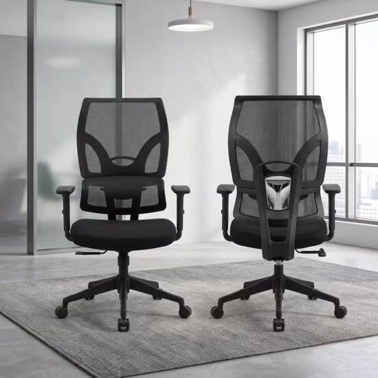 Premium Orthopedic High-Back Office Chair featuring an open-airflow black mesh backrest, integrated lumbar support section, flat T-shaped armrests, a plush black seat cushion, and a matte black five-star star base with rolling wheels, standing in a bright corporate office.