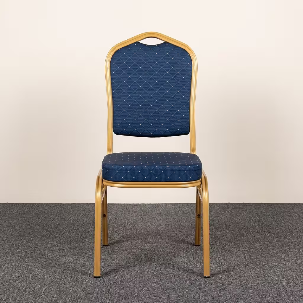 Premium Blue Banquet Chair With Gold Steel Frame featuring a crown-back design in royal blue fabric with gold dots and a highly reflective glossy gold steel frame, standing on a polished event floor.