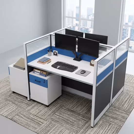 Premium 2-Way Workstation With Mobile Pedestal in a white and dark grey finish, displaying a back-to-back cubicle layout with a sleek laptop, writing utensils, a ceramic mug, electric blue accents, and an integrated lockable under-desk mobile filing cabinet resting on a light grey carpet.