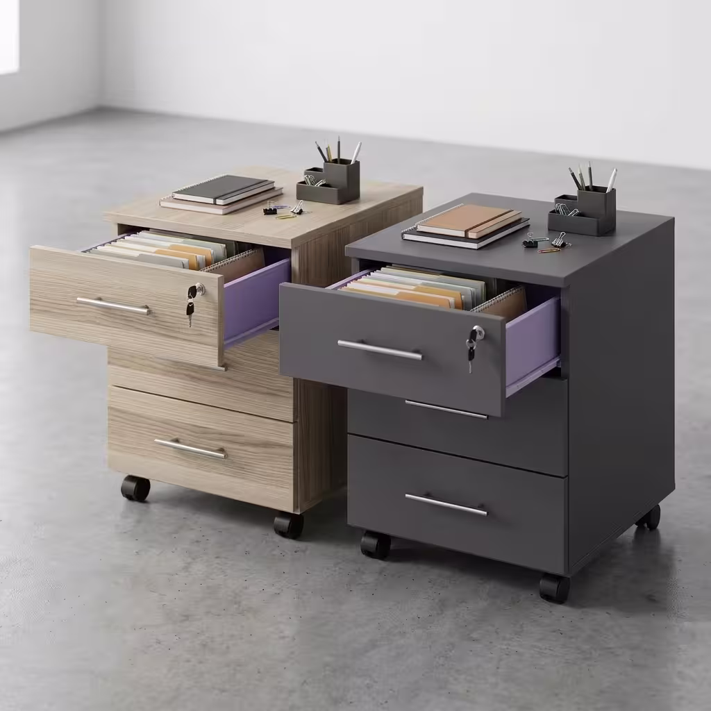 Two premium 3-Drawer Lockable Mobile Pedestals placed side by side on a polished grey concrete floor, showing one finished in a light oak woodgrain and the other in a matte graphite grey, each featuring an open top drawer with a key inserted, revealing a lavender purple inner lining and folder files.