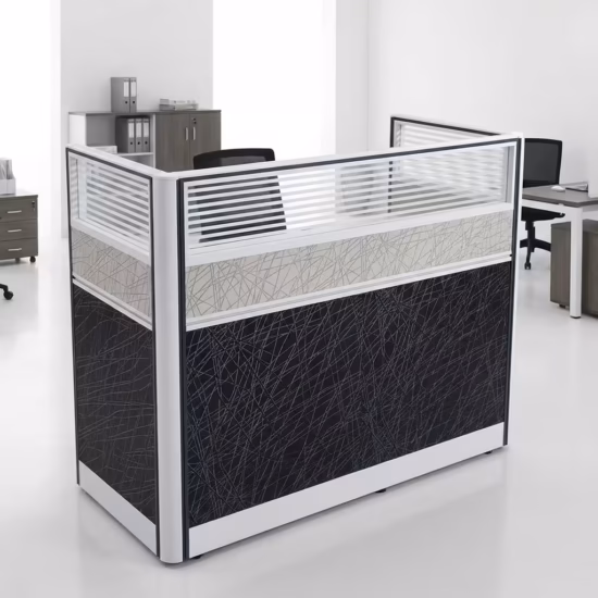 Premium One-Way Modular Office Workstation in a rich walnut woodgrain finish, showcasing a single rectangular tabletop with an integrated privacy partition panel, a lockable storage drawer unit with a key inserted, displaying a silver laptop and a ceramic mug, standing on a polished concrete floor.