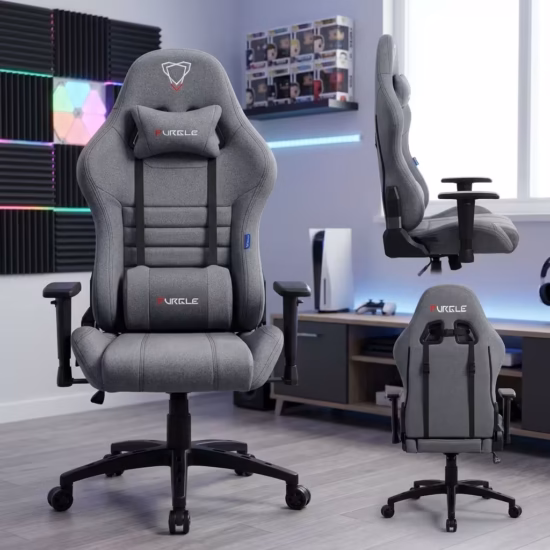 Premium Executive Fabric Gaming Chair in slate gray fabric weave upholstery, featuring an adjustable neck pillow, an oversized lower lumbar cushion, T-shaped adjustable armrests, and a heavy-duty black five-star star base with rolling wheels, standing on a light wood floor.