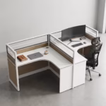 Premium 2-Way Curved Office Workstation showcasing an elevated perspective of a back-to-back dual user layout, featuring curved L-shaped white tables with natural woodgrain side panels, integrated translucent slatted glass privacy partition screens, and active workspaces with a curved monitor, laptop, and a black mesh ergonomic task chair on a smooth grey concrete floor.
