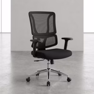 Premium mid-back Office Chair With Lumbar Support featuring a black open-mesh backrest, adjustable T-shaped armrests, a thick fabric seat cushion, and a reflective polished chrome star base with rolling wheels, standing on a polished concrete floor.