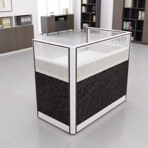 Premium One-Way Modular Office Workstation in a rich walnut woodgrain finish, showcasing a single rectangular tabletop with an integrated privacy partition panel, a lockable storage drawer unit with a key inserted, displaying a silver laptop and a ceramic mug, standing on a polished concrete floor.