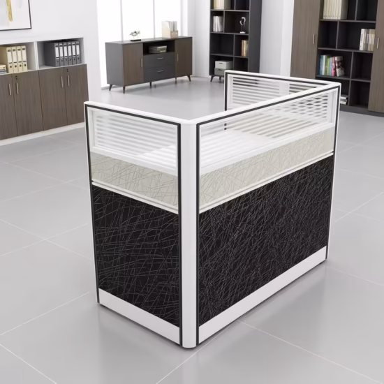 Premium One-Way Modular Office Workstation in a rich walnut woodgrain finish, showcasing a single rectangular tabletop with an integrated privacy partition panel, a lockable storage drawer unit with a key inserted, displaying a silver laptop and a ceramic mug, standing on a polished concrete floor.