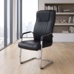 Premium High Back Conference Chair featuring a black leatherette high-backrest with vertical rib lines and a distinct headrest section, integrated chrome armrests with matching black top pads, and a highly reflective continuous chrome steel cantilever sled frame, standing on light oak wood flooring next to a modern wall bookshelf.