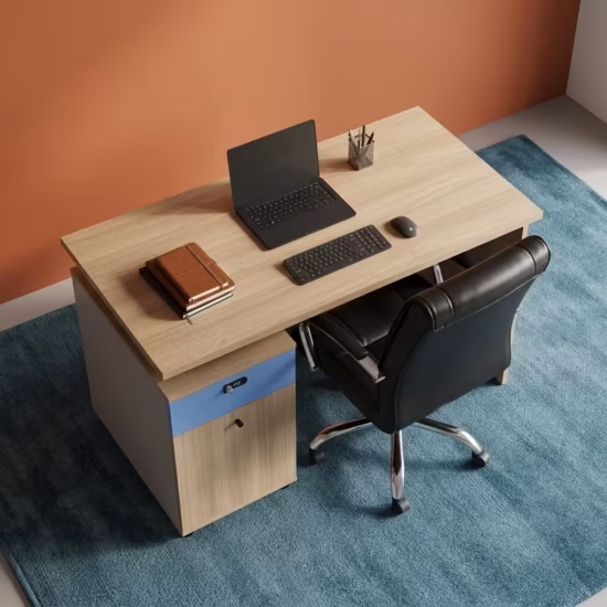 Premium 1.2M Wooden Office Desk With Storage in a light oak woodgrain finish, featuring an integrated slate-blue side return storage console with a key lock, a built-in dark brown leather desk blotter mat supporting a closed dark laptop and mouse, paired with a high-back black leather swivel rolling chair on a textured carpet.