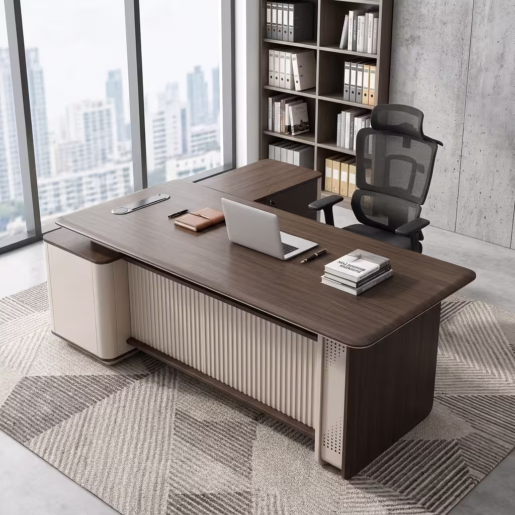 Premium 2.2M Executive CEO's Office Desk featuring a rich walnut woodgrain finish, an integrated tan leather desk blotter mat supporting a wireless mouse and keyboard, a front modesty panel with an off-white vertical fluted slatted design, and an attached side return storage console supporting stacked books, paired with a high-back black mesh office chair on a textured grey area rug.