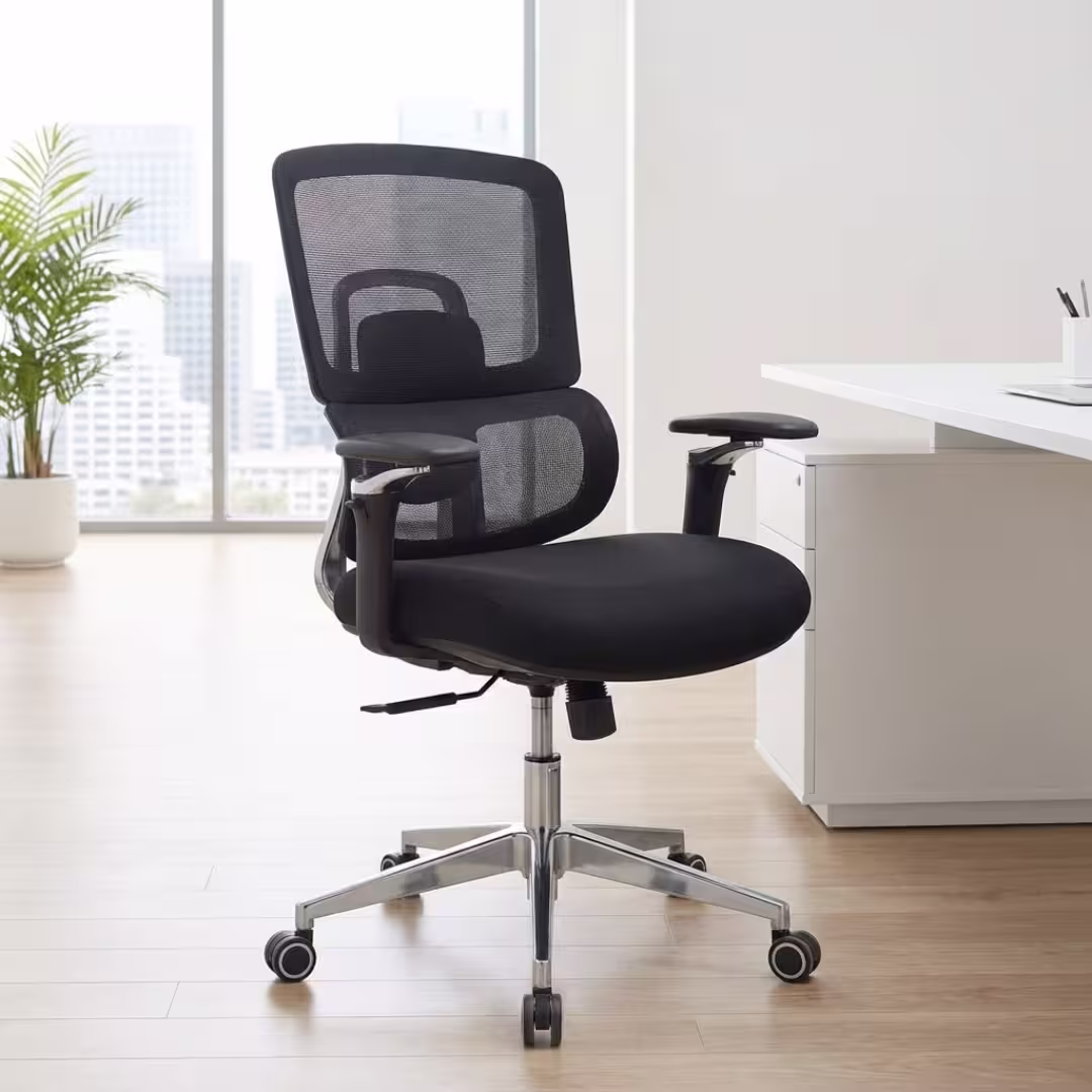 Premium Medium Back Orthopedic Mesh Office Chair featuring an open-airflow black mesh split backrest, flat black adjustable armrests with polished chrome support bars, a thick black fabric seat cushion, and a highly reflective polished metal five-star star base with rolling wheels, standing on a textured grey woven area rug.