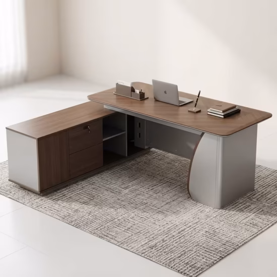 Premium 1.8M Executive Director's Office Desk in a dark charcoal-brown woodgrain finish, featuring a vertical matte grey fluted slatted front modesty panel, an integrated left-side return storage console, a right-side drawer block pedestal, a desktop supporting an open silver laptop, a leather notebook, and a ceramic mug, resting on a textured striped grey area rug.