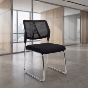 Premium Armless Guest Office Chair featuring a black mesh mid-backrest, a thick fabric upholstered seat cushion, an armless low-profile silhouette, and a continuous matte black steel cantilever sled frame, standing on a polished concrete floor.