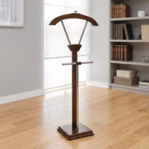 Premium Executive Office Coat Hanger Stand in a dual-tone rich walnut woodgrain and polished chrome finish, showcasing a wide arched top wooden jacket hanger supported by a V-shaped chrome bracket, a horizontal chrome trousers bar, a dual-pillar vertical spine, and a sturdy square beveled base pedestal, standing on polished hardwood flooring in an office corner by a window.