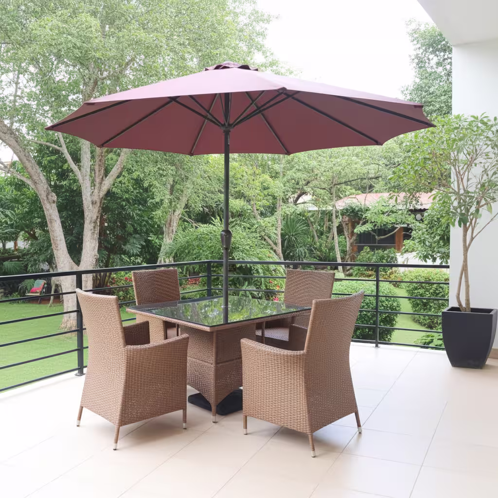 Buy the heavy-duty 4-Seater Outdoor Set With Patio Umbrella. Features four hand-woven tan synthetic wicker armchairs, a square black glass dining table, and a crimson red crank-lift sun umbrella.