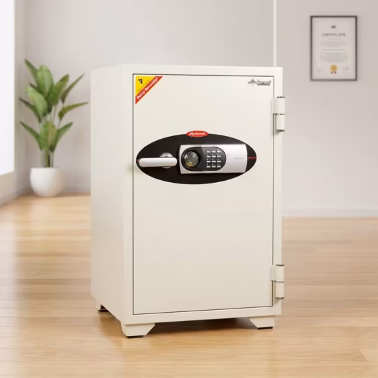 Premium 122Kg Diplomat Fireproof Safe in a durable textured off-white powder-coated steel finish, showing a thick front door fitted with a horizontal silver pull-handle, a black-paneled digital electronic keypad, a manual key override slot, and visible heavy-duty side hinges, standing flat on smooth polished hardwood laminate flooring against an off-white studio background.