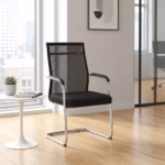 Premium Cantilever Mesh Office Visitor Seat featuring an open-airflow black mesh backrest, integrated chrome armrests with black top pads, a plush black fabric seat cushion, and a highly reflective continuous chrome steel cantilever sled base, standing on a polished hardwood floor next to a white round pedestal side table.