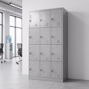 Premium 12-Locker Filing Steel Locker Cabinet in a professional light grey powder-coated steel finish, showcasing a 3x4 grid layout of twelve closed locker doors with recessed handles, cylinder locks with keys inserted, name card frames, and stamped bottom ventilation slits, standing flat on smooth light wood flooring against a textured grey background.