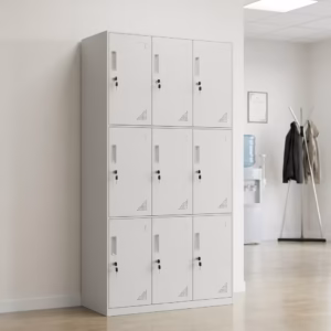 Premium 9-Locker Steel Office Cabinet in a professional light grey powder-coated steel finish, showcasing a 3x3 grid layout of nine closed locker doors with recessed handles, cylinder locks with keys inserted, and stamped corner ventilation holes, standing flat on smooth light wood flooring inside a modern office entryway corridor.